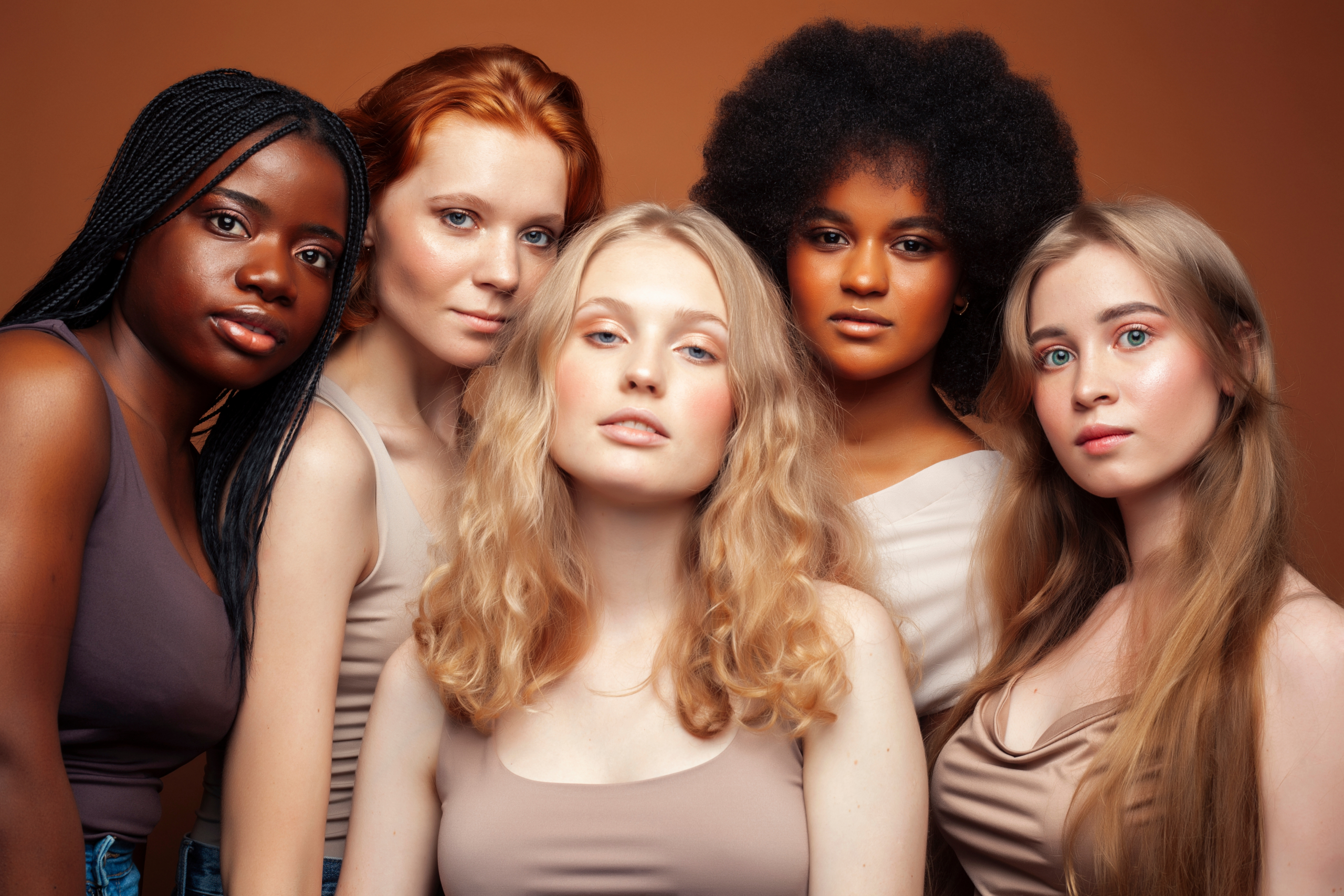 2 Black and 3 white girls having photoshoot